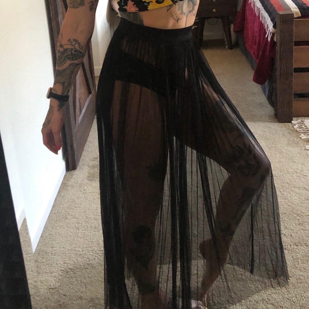 Black pleated see through mesh skirt. Fits S or M